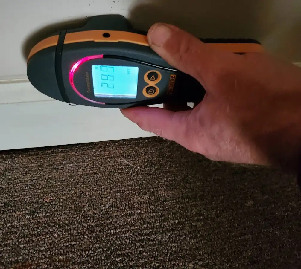 Moisture detection at baseboard during Storm Damage Restoration in Aspen